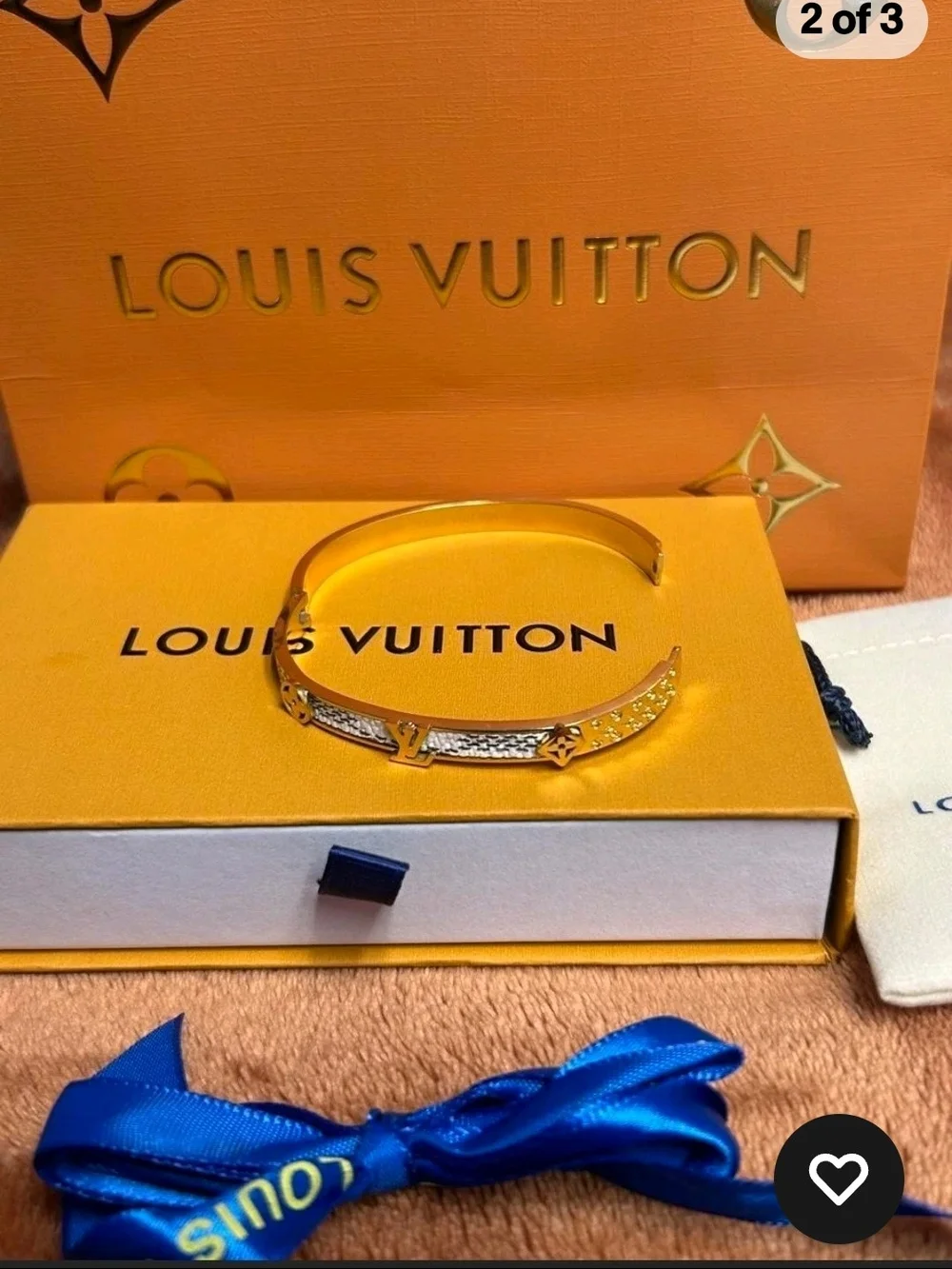 Louis Vuitton Gold Bracelet with Blue Ribbon Accent